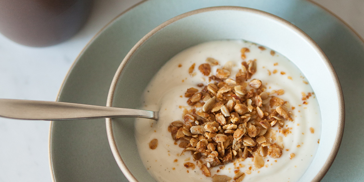 photo of yogurt and granola in ceramic ware