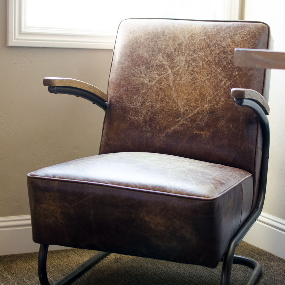 photo of vintage leather chair by window