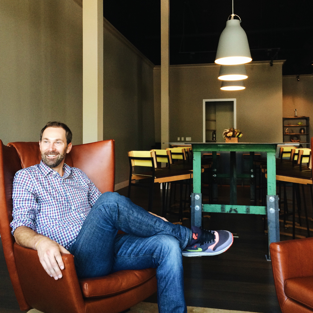 photo of Mark Hoffmeister, owner, seated in lobby